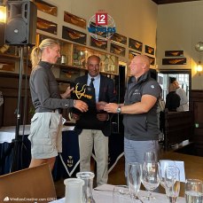 Jenetta (K-1) crew accepts 3rd place overall Daily prize from Mikael Stelander